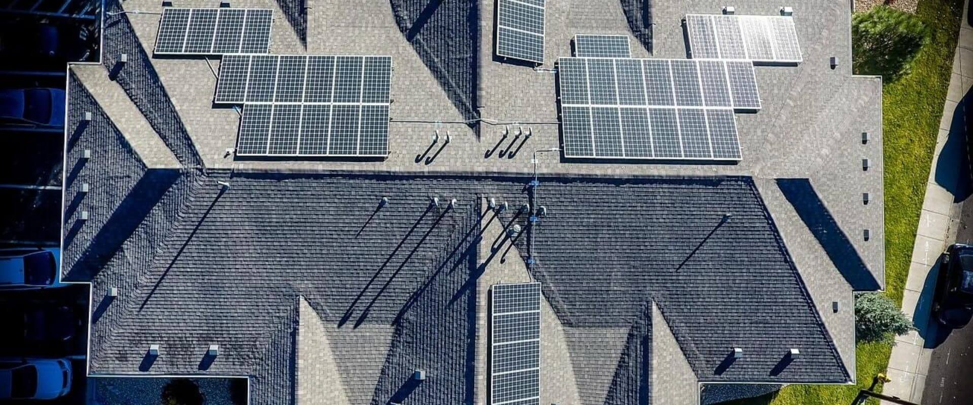 top view of a shingle roof with solar panels